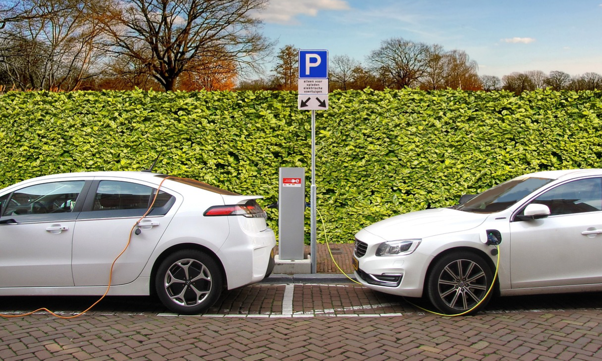 Electric Vehicle (EV) charging station showing two cars charging their batteries